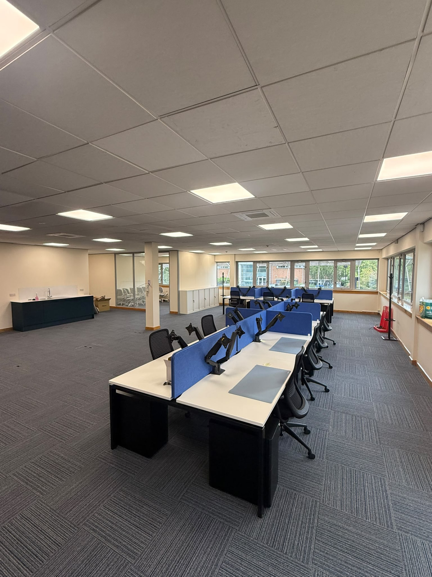 The completed office run of desks with the teapoint and glazing in the background