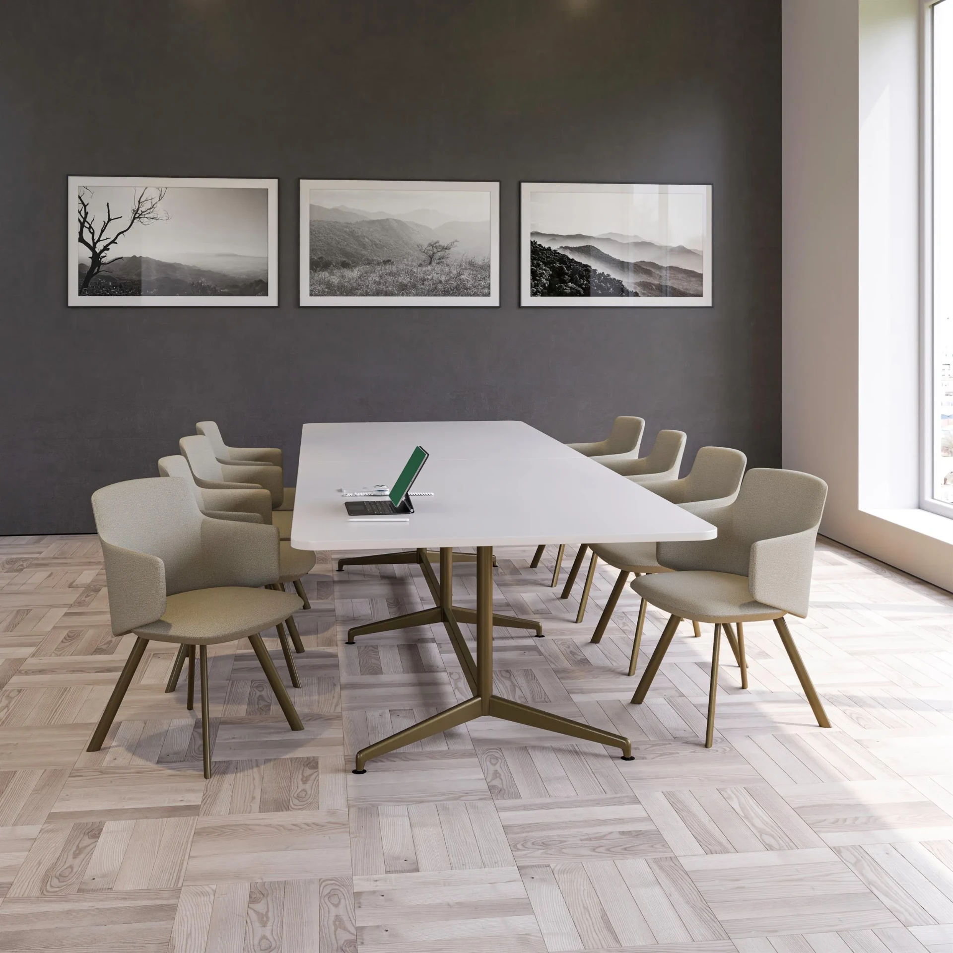A meeting room with a white table, boucle chairs and monochrome artwork
