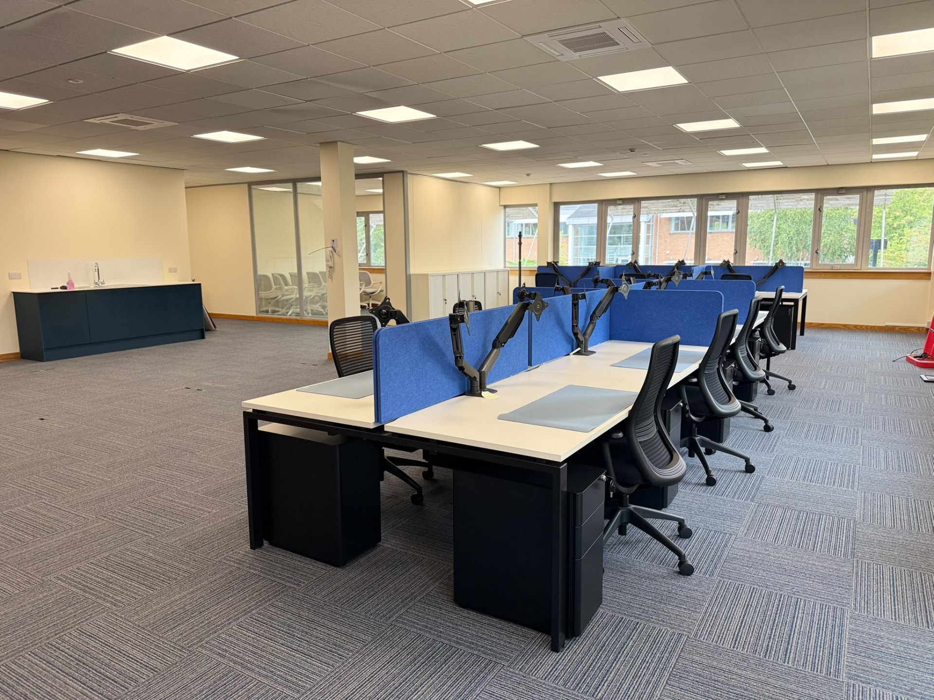The first workstations installed across the open-plan floor