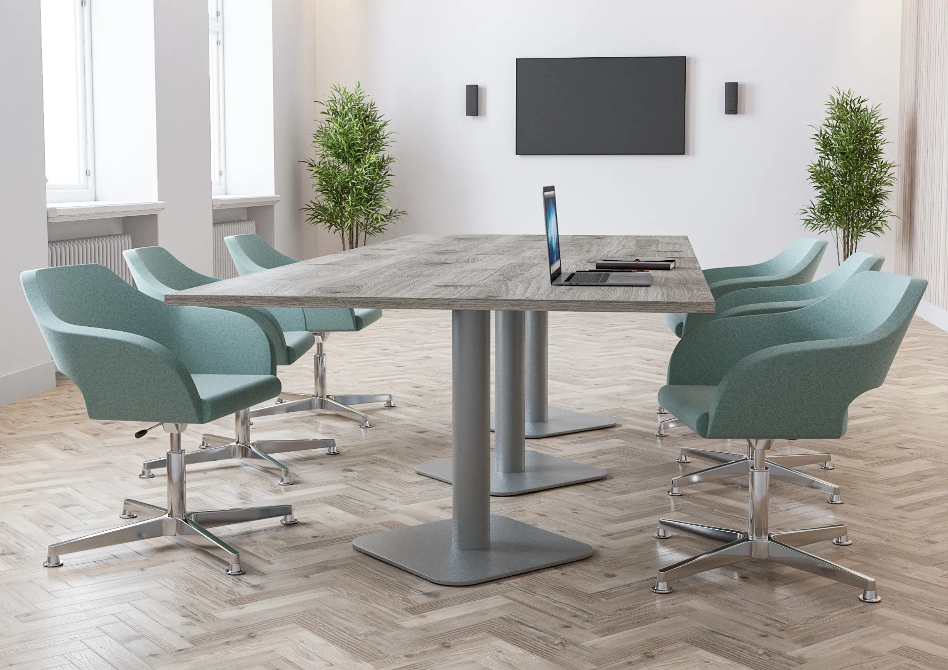 A meeting room with a stone-effect table and mint-green swivel chairs