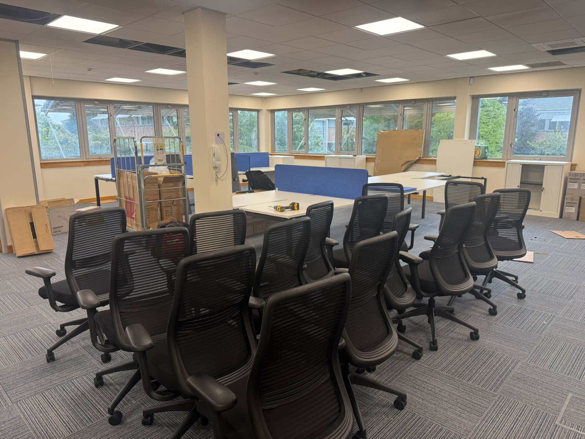 Installation underway with task chairs ready to be positioned at the new desks